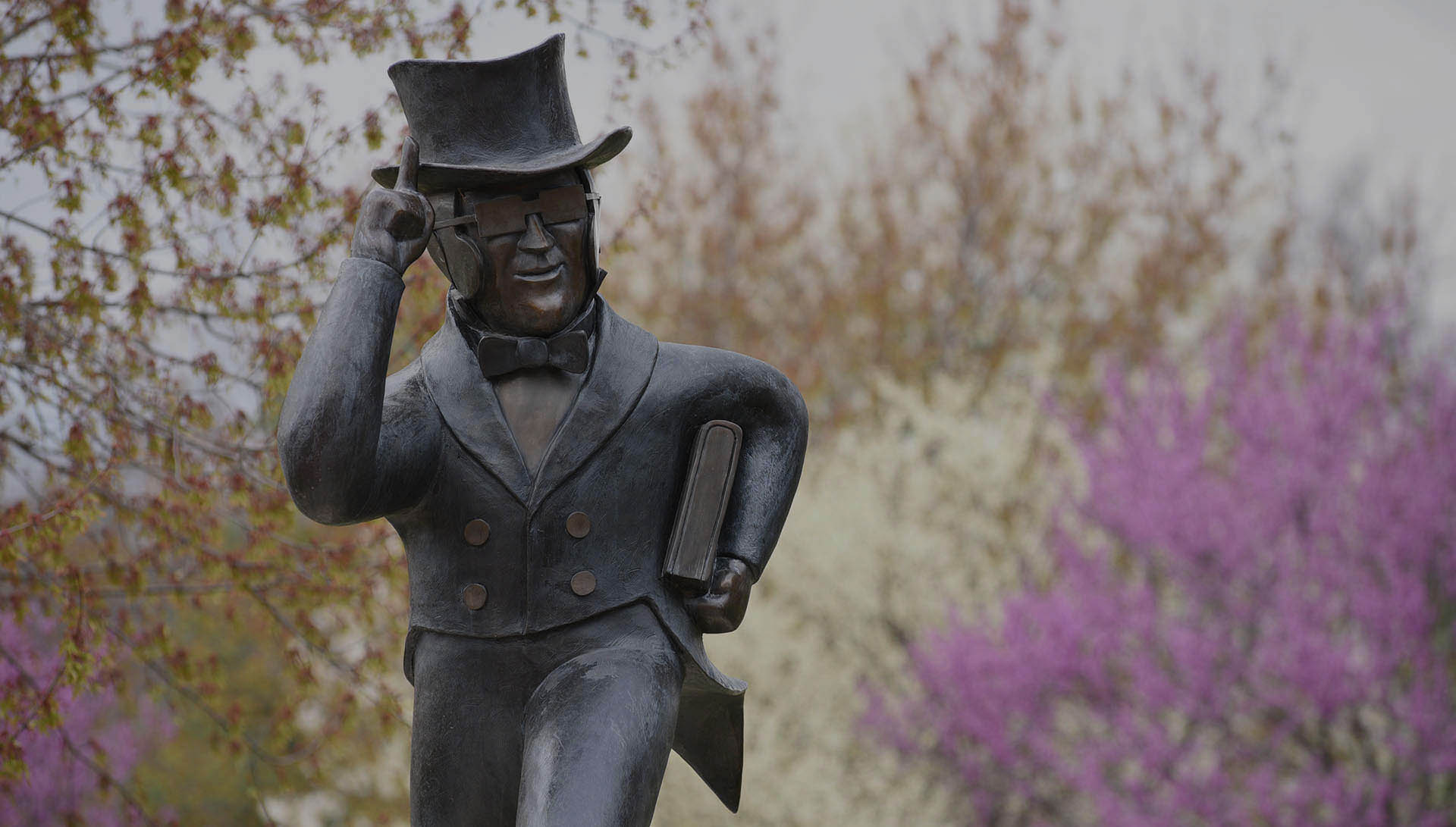 Ichabod statue with trees behind