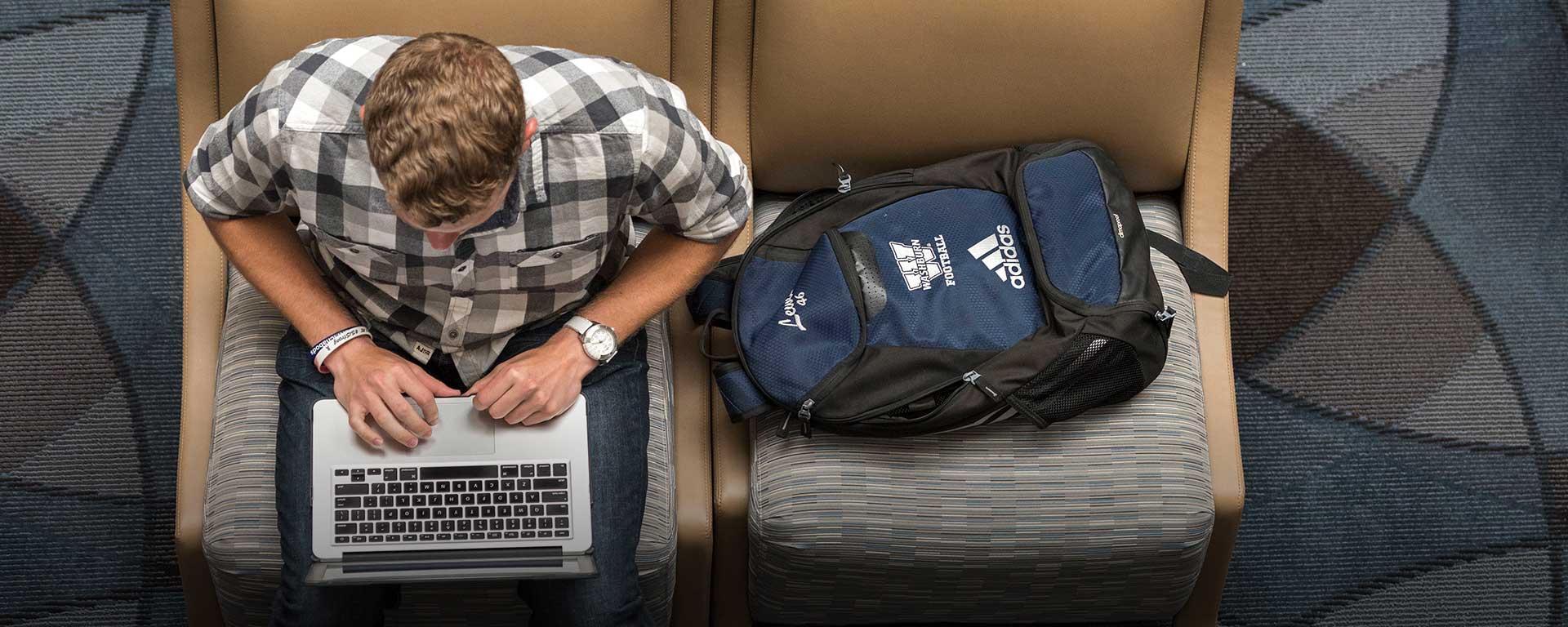 male student on laptop