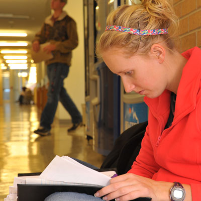 student studying in hallway