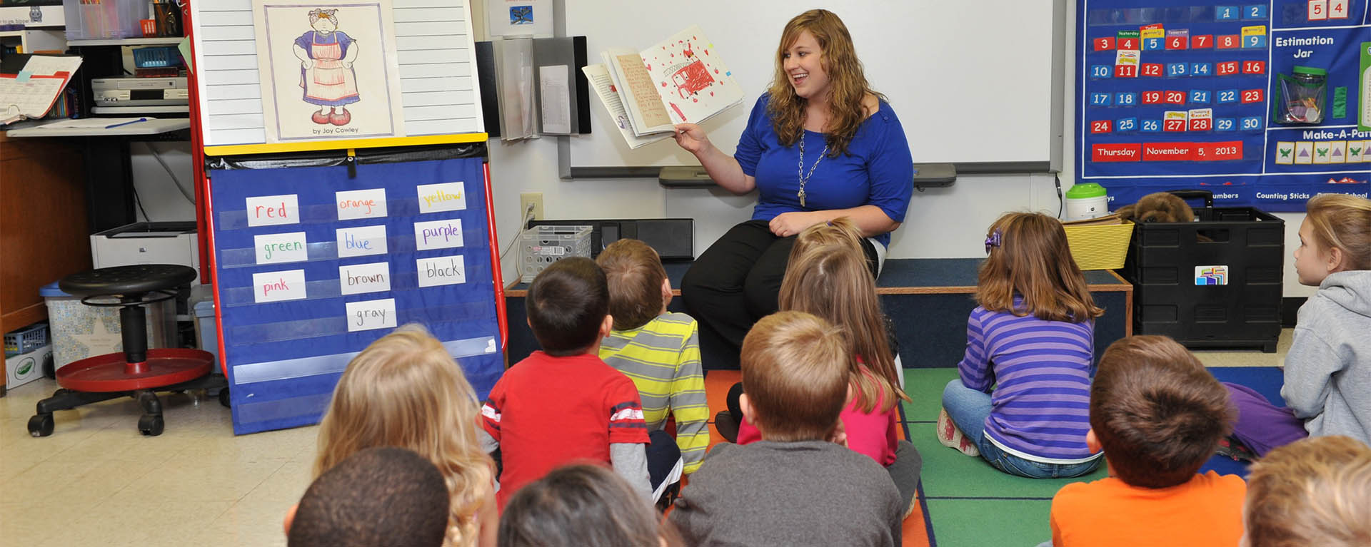 Education student reading to children