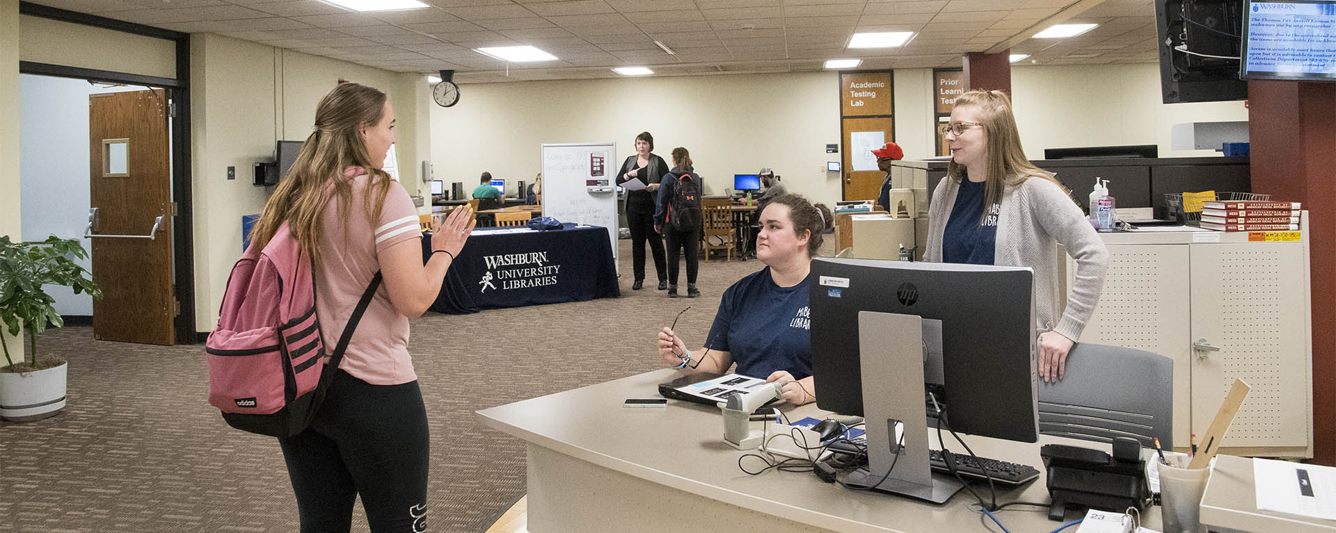 Washburn students work together in Mabee Library.