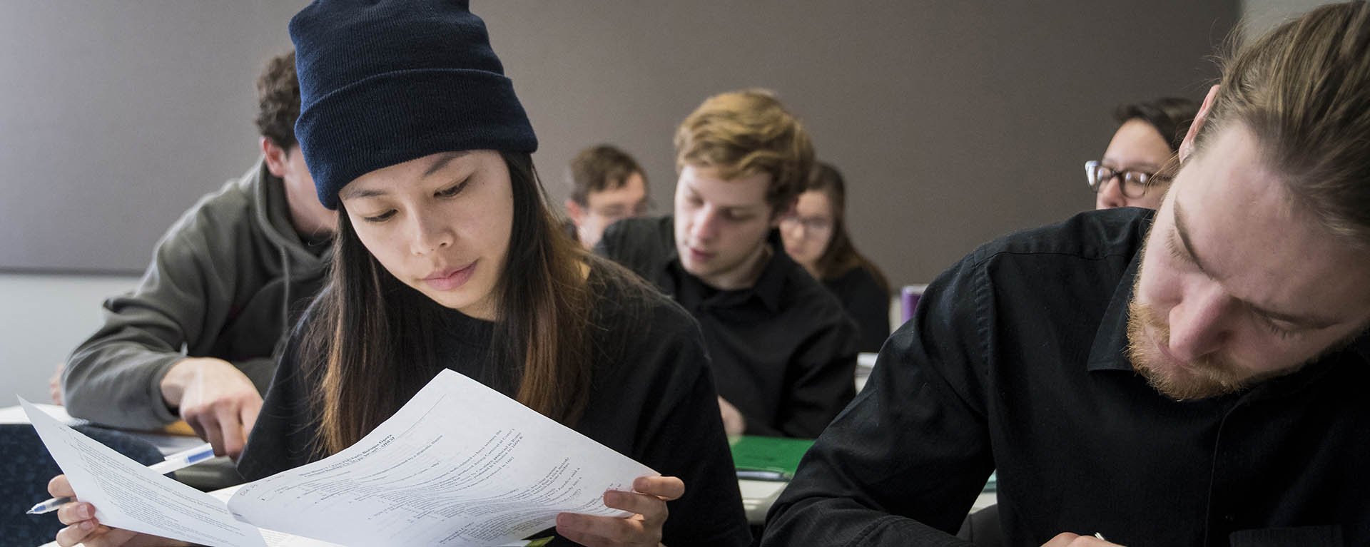 A student studies an assignment while in class.