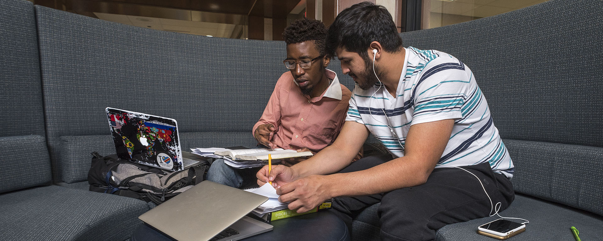 Two international students work on a project in the Morgan Hall Welcome Center.