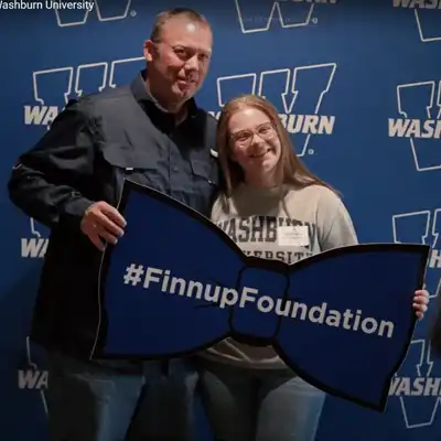 Students pose for a photo with Mr. Ichabod.