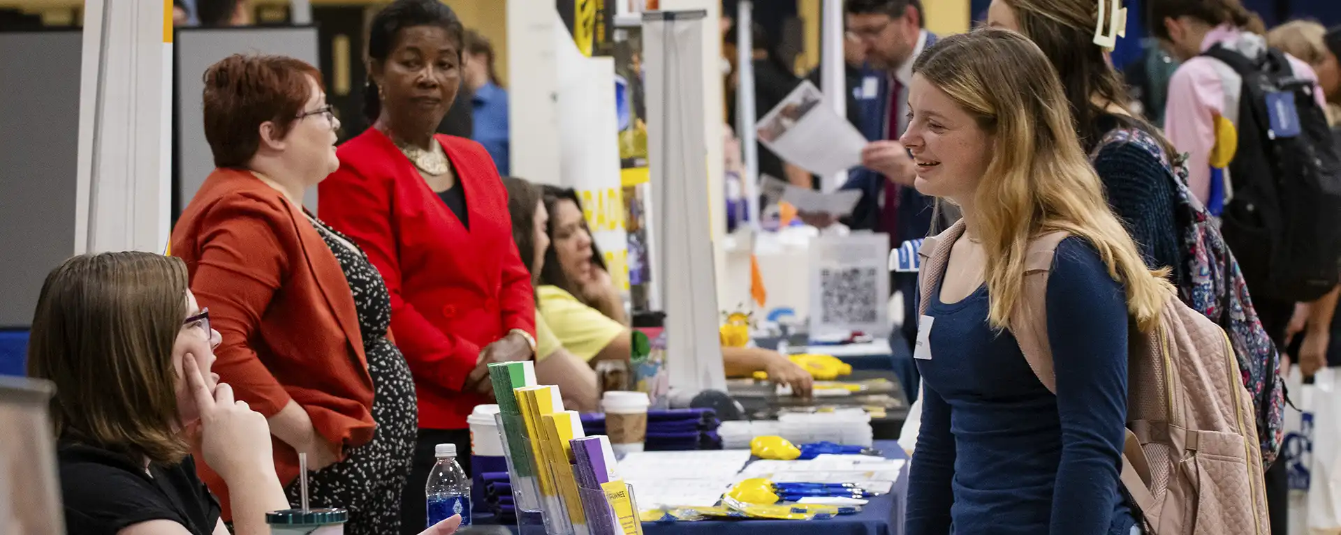 A student talks with a prospective employer during the healthcare career fair.