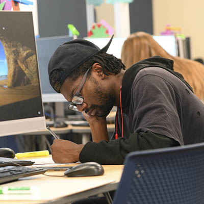 A student works on a written assignment.