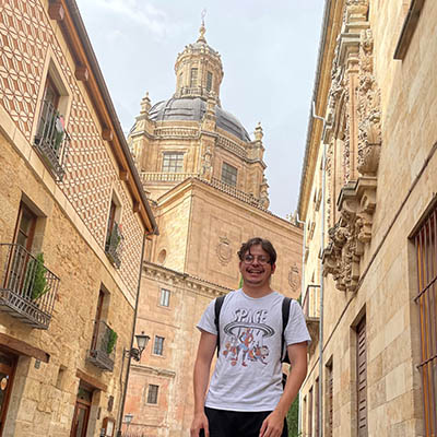 A student smiles while on a study abroad trip.