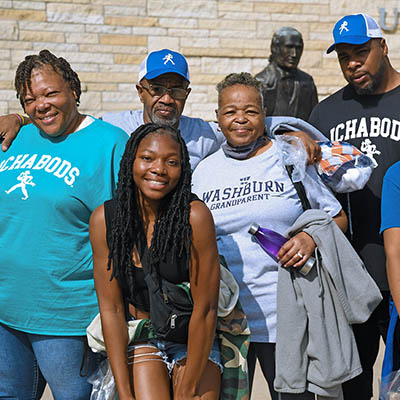 family smiling at event