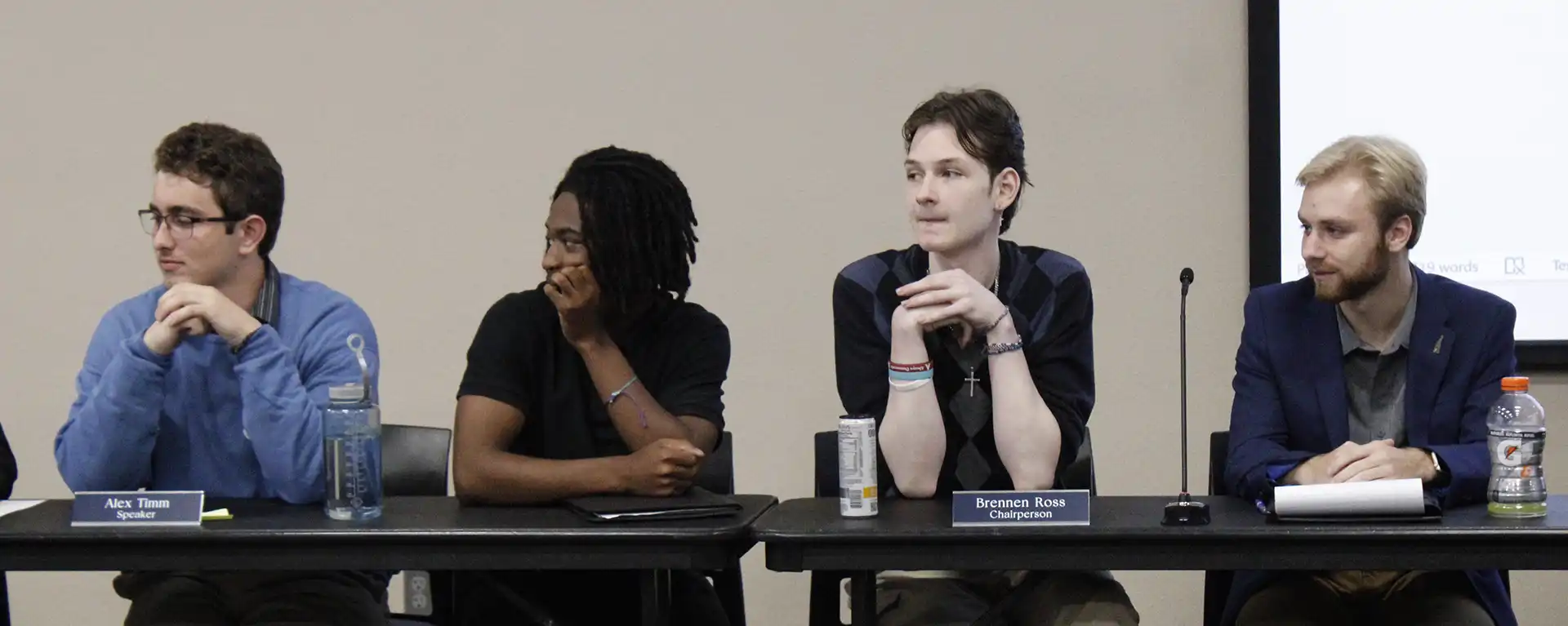 4 wsga students at a WSGA meeting.